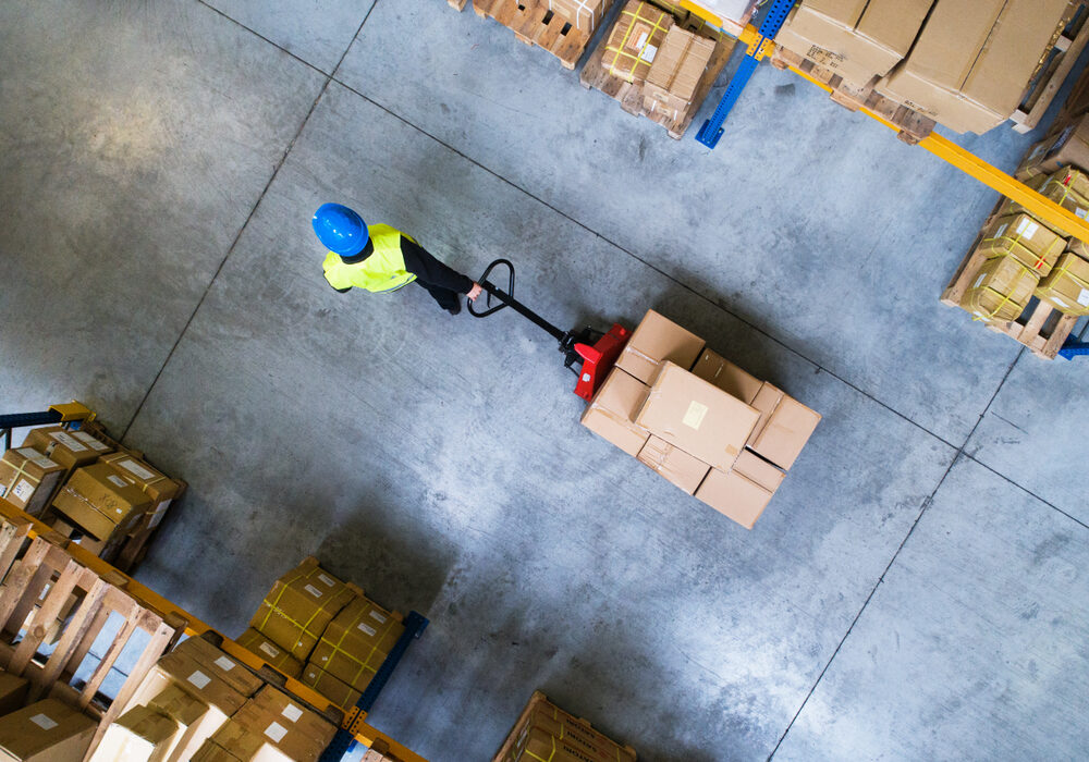 Male,Warehouse,Worker,Pulling,A,Pallet,Truck.